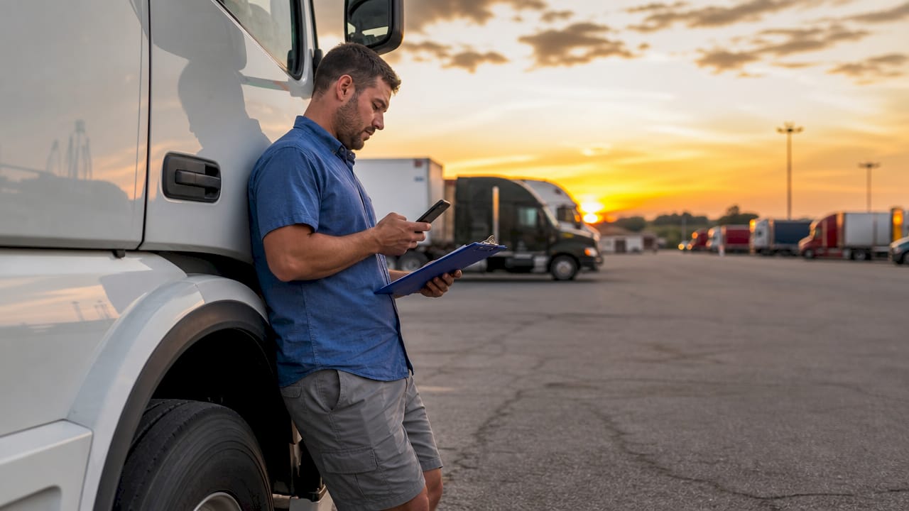 Truck fleet owner managing factoring at loading dock
