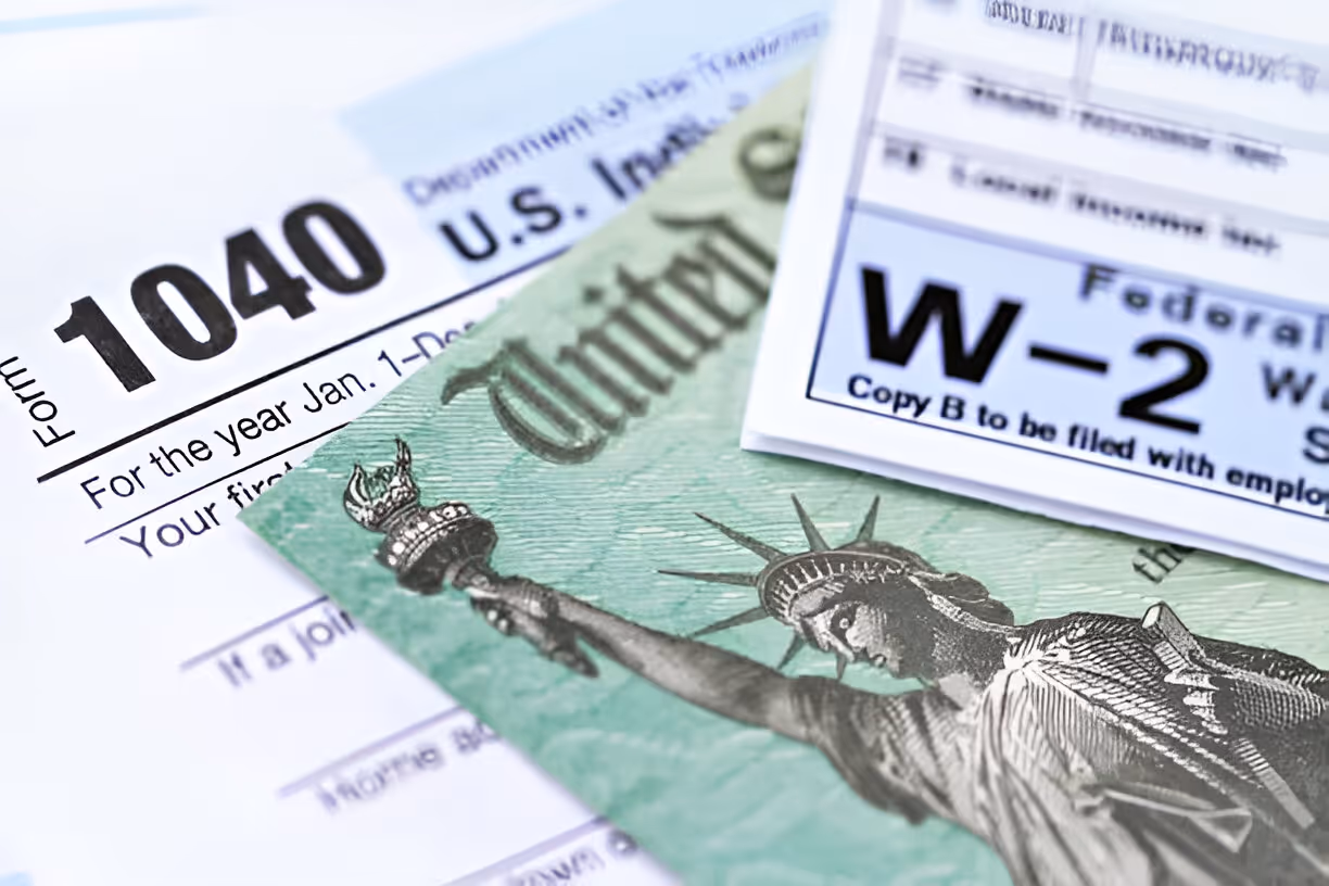 Tax forms with Statue of Liberty on US income tax return document