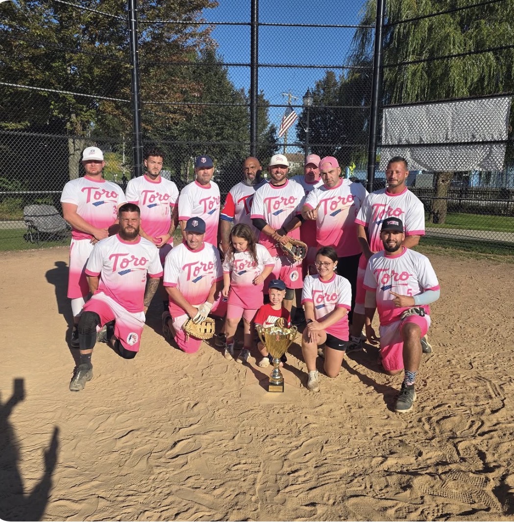 Toro-sponsored softball team with championship trophy