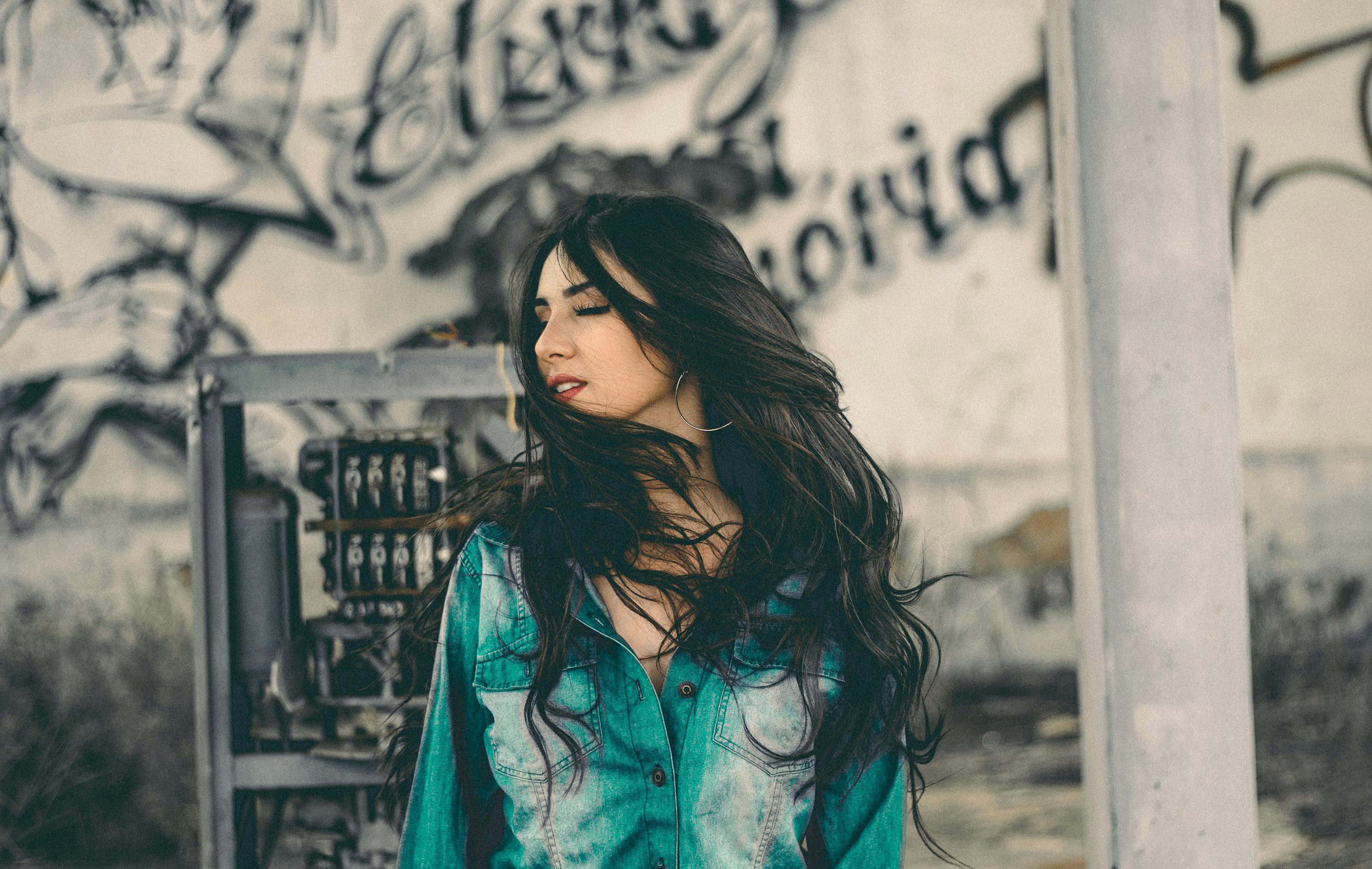 Woman with flowing hair outdoors, demonstrating natural movement of quality extensions