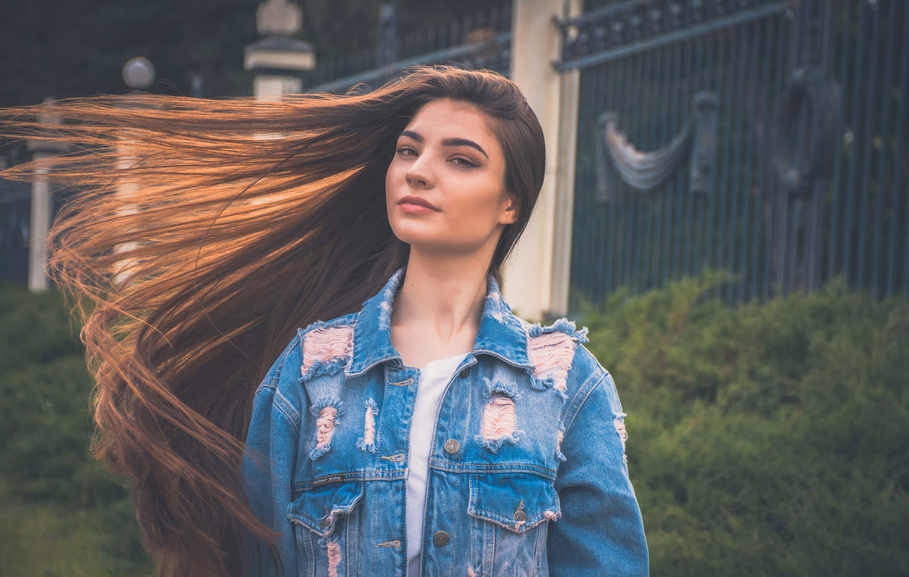 woman waving her long brown hair