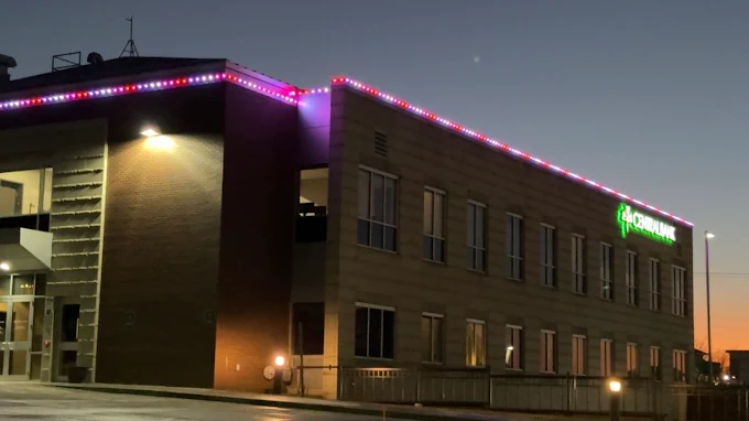 Professionally installed permanent lighting by 605 Holiday Lighting on the Central Bank
