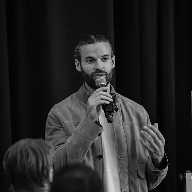 Black and white man speaking