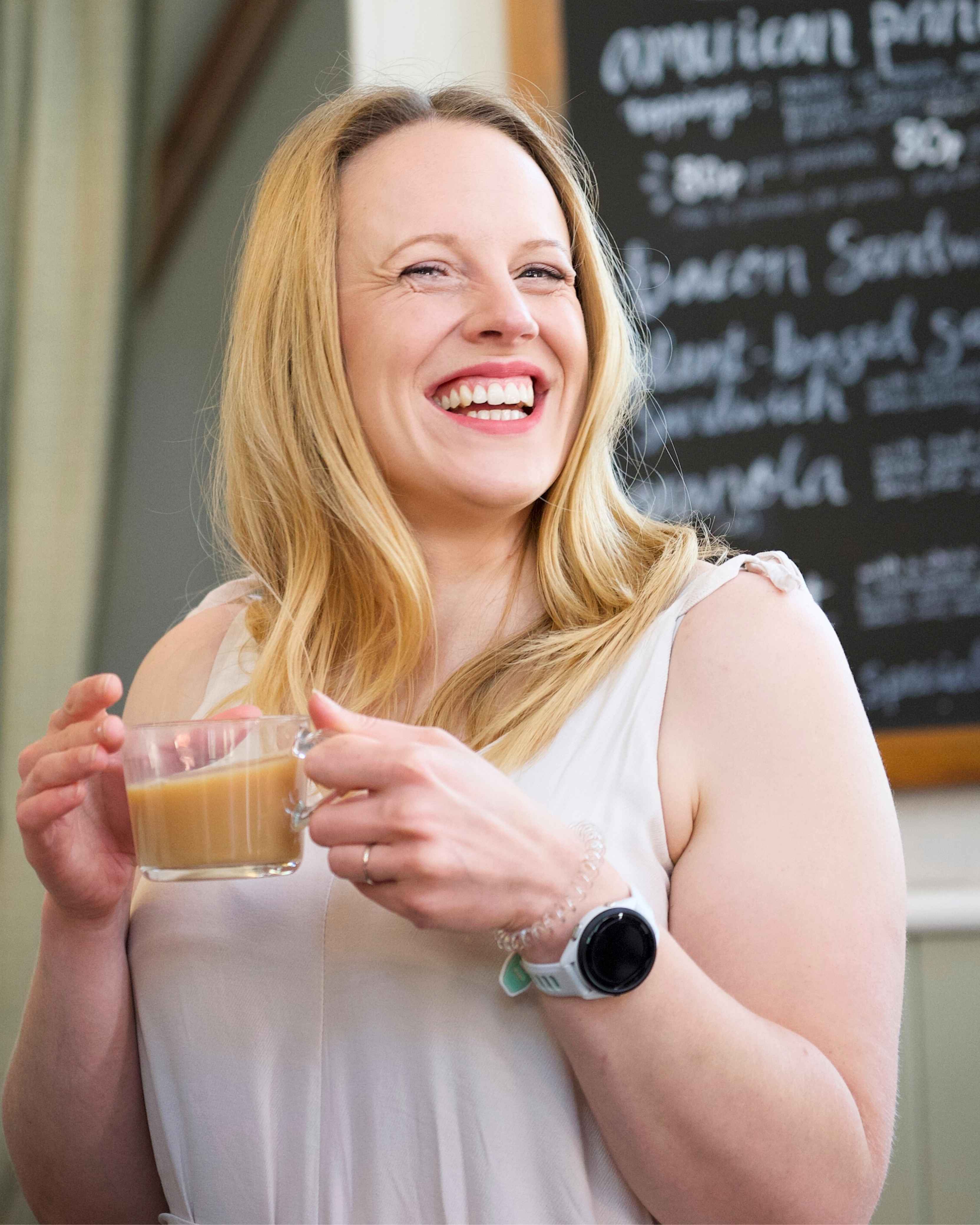A lady smiling at The Table Coffee Shop Cardiff. 