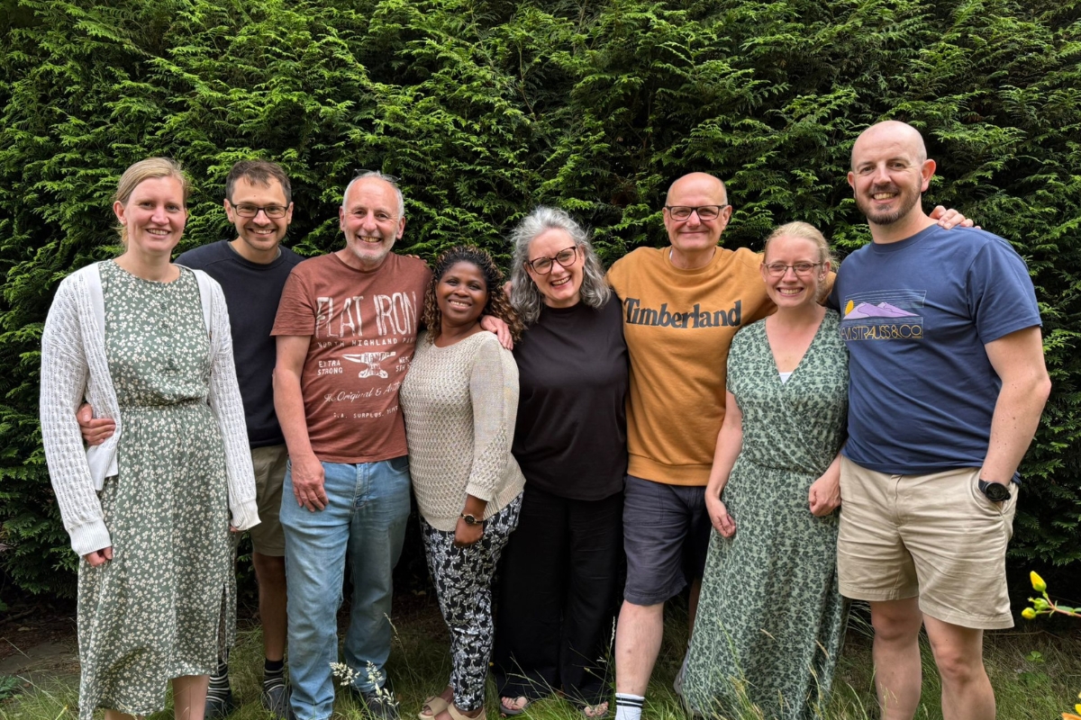 A group of 8 leaders smiling at Emmanuel Church Cardiff.