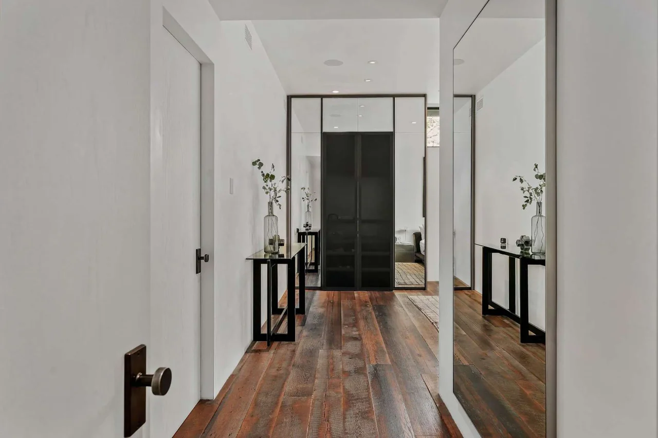 Hallway with timber floor and framed doorways at Rivas Canyon.