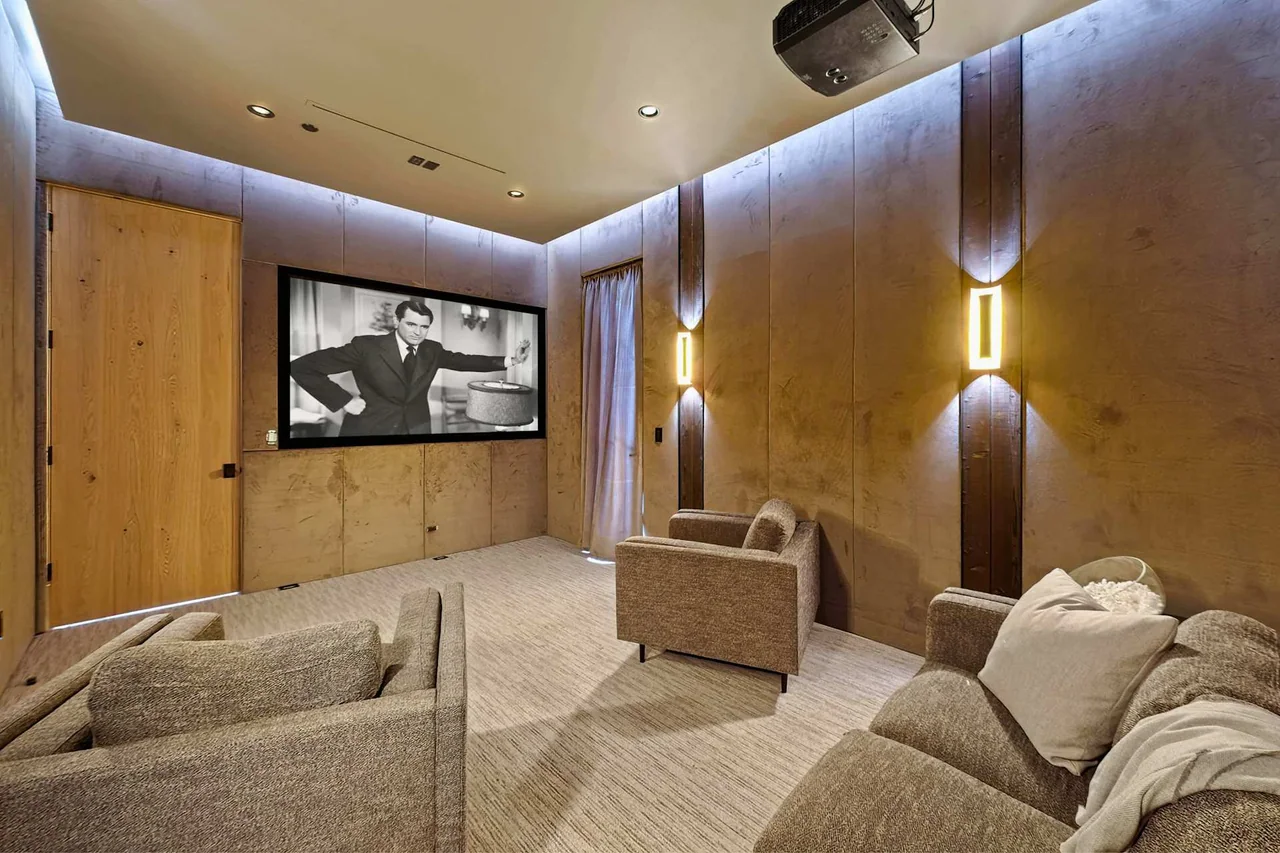 Cinema room with timber walls at South Gretna Green Way.