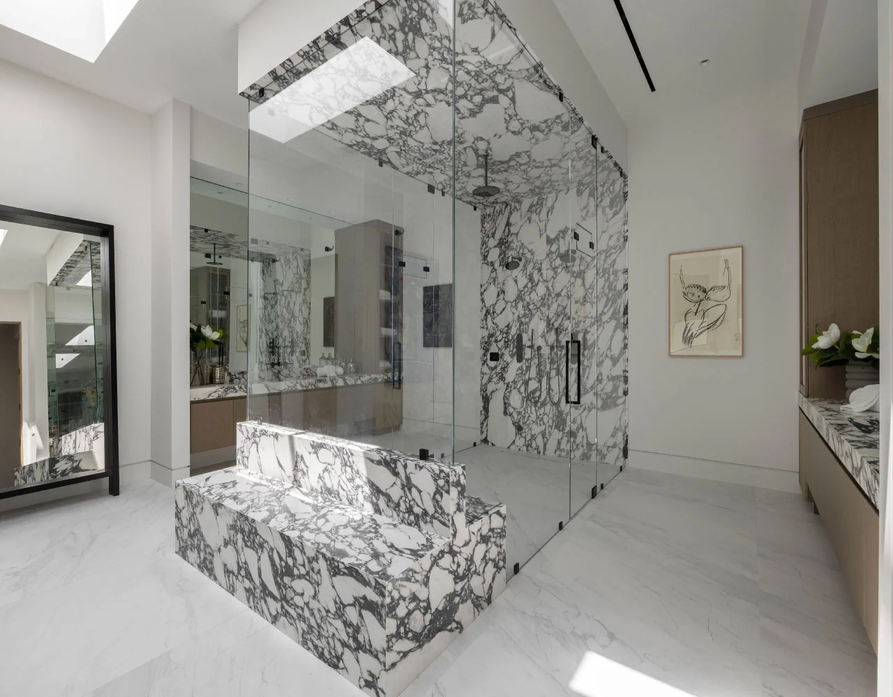 Veined shower enclosure and vanity at Petit Avenue.