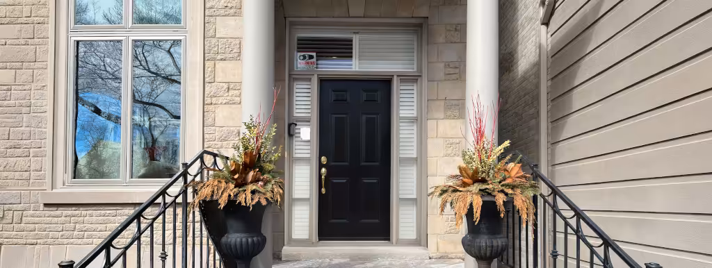 Before: original entry door with shuttered sidelites