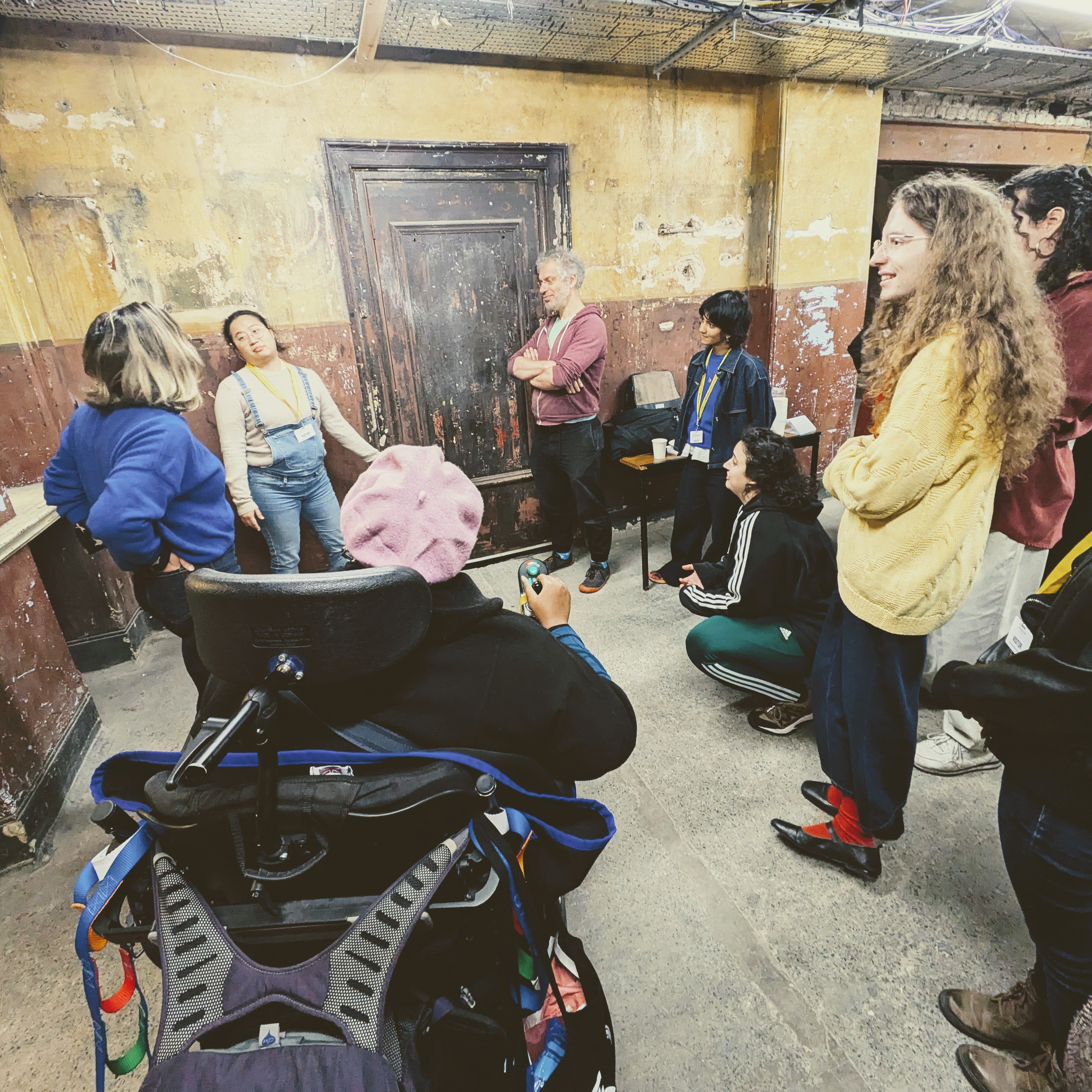 A group of artists inside Shoreditch Town Hall basement
