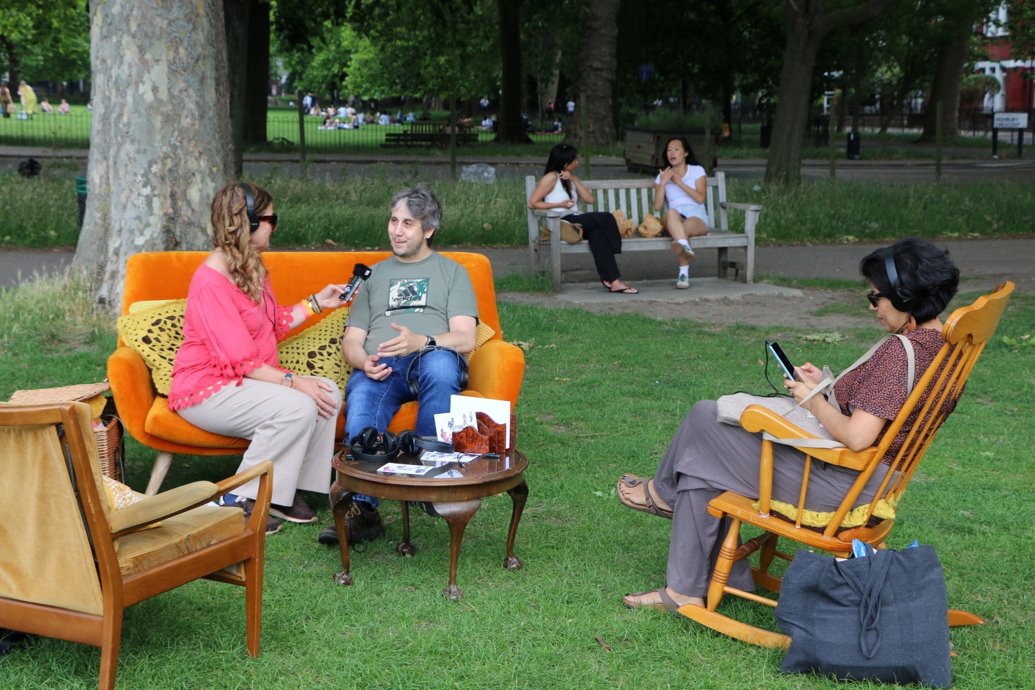 Audience members sitting in an outdoor vintage living room
