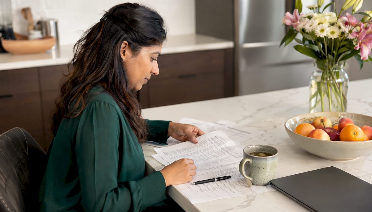 Woman reviewing SaaS sales call transcripts