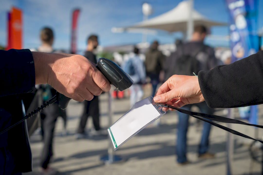 Hand scanning badge at trade show
