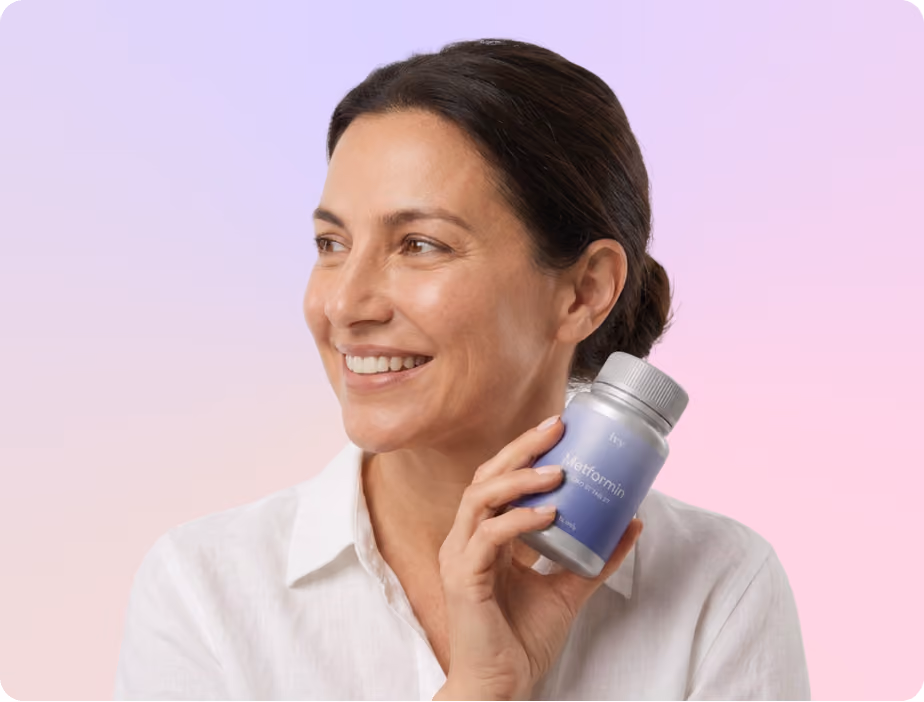 Smiling woman with curly hair holding a small vial labeled 'ivy GLP-1 Injection Rx only' against a teal background.