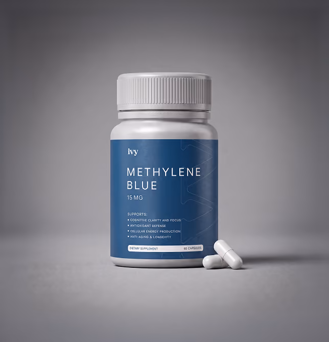 Bottle of 15 mg Methylene Blue dietary supplement with two white capsules on gray surface.