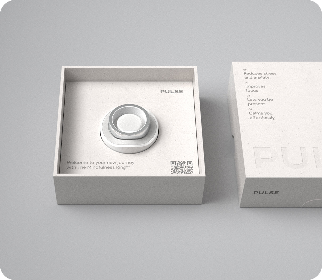 Silver Mindfulness Ring in white box with Pulse branding and list of stress relief benefits on lid.