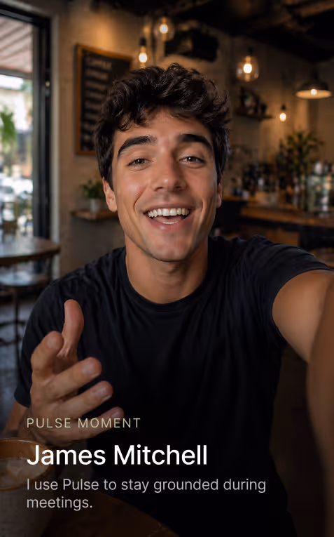 Smiling man in black shirt sitting in cafe, holding out hand, with text about using Pulse to stay grounded.