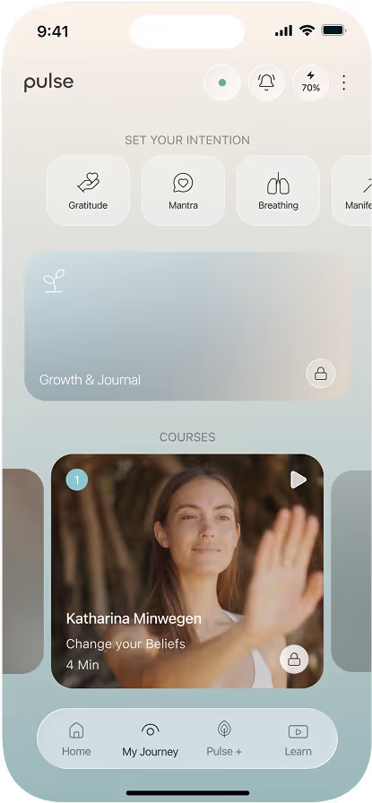Wellness app screen showing intention options and a course featuring a woman raising her hand.