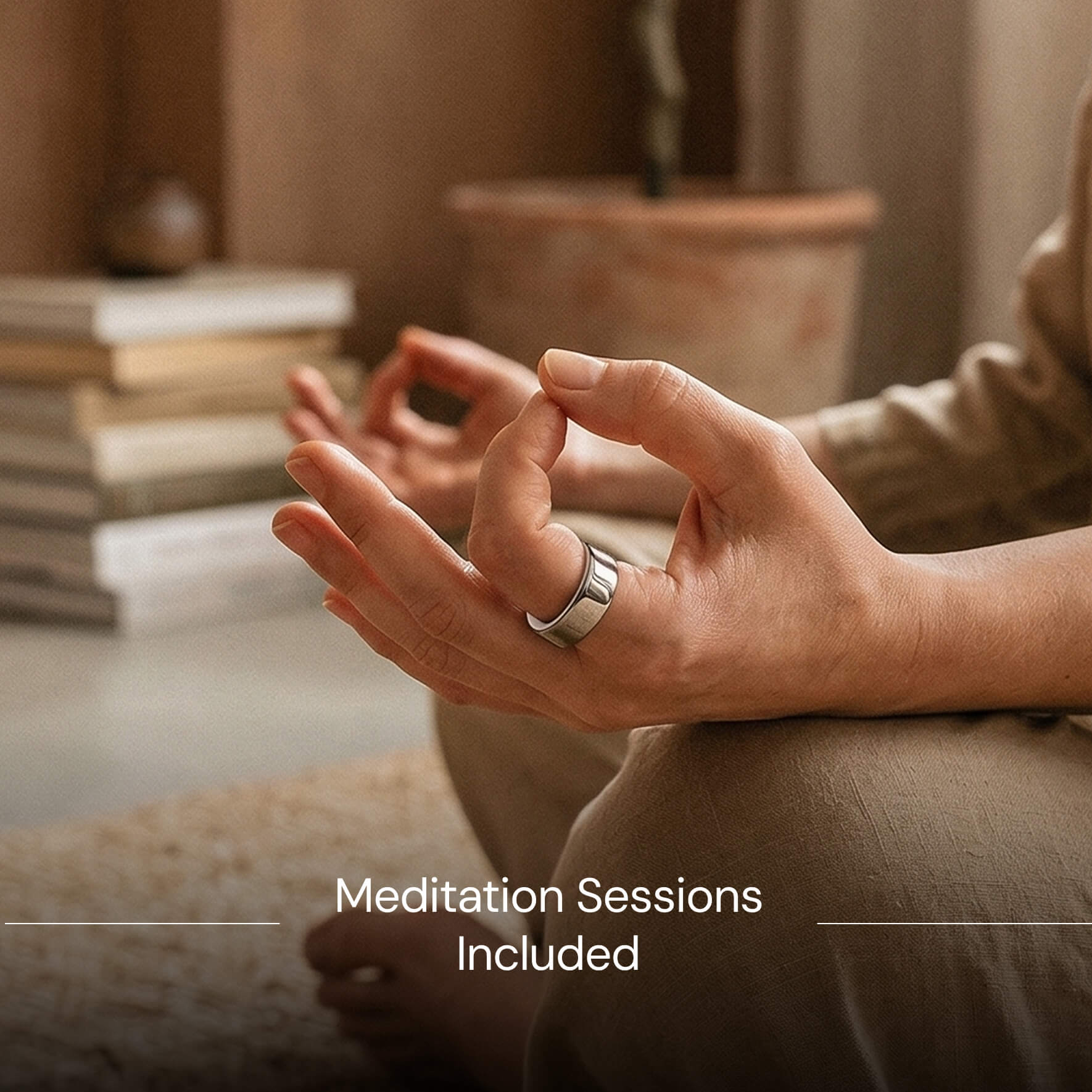 Close-up of hands in meditation mudra pose wearing a silver ring, with blurred books and plant in background.