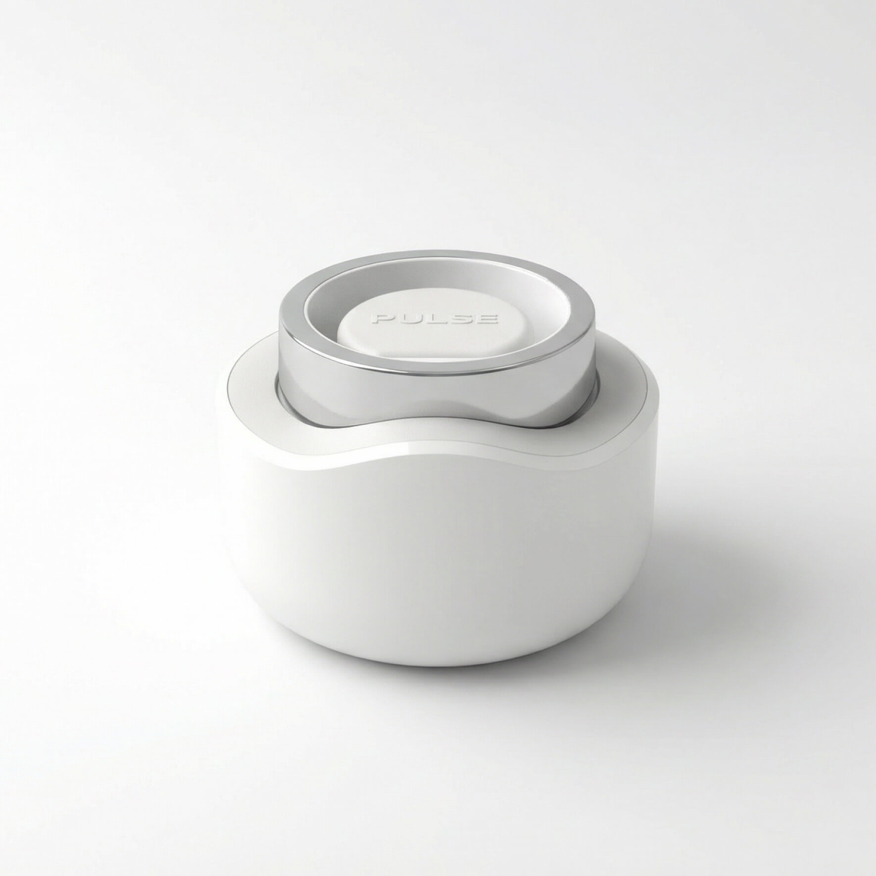 White and silver circular device with the word PULSE embossed on top against a white background.