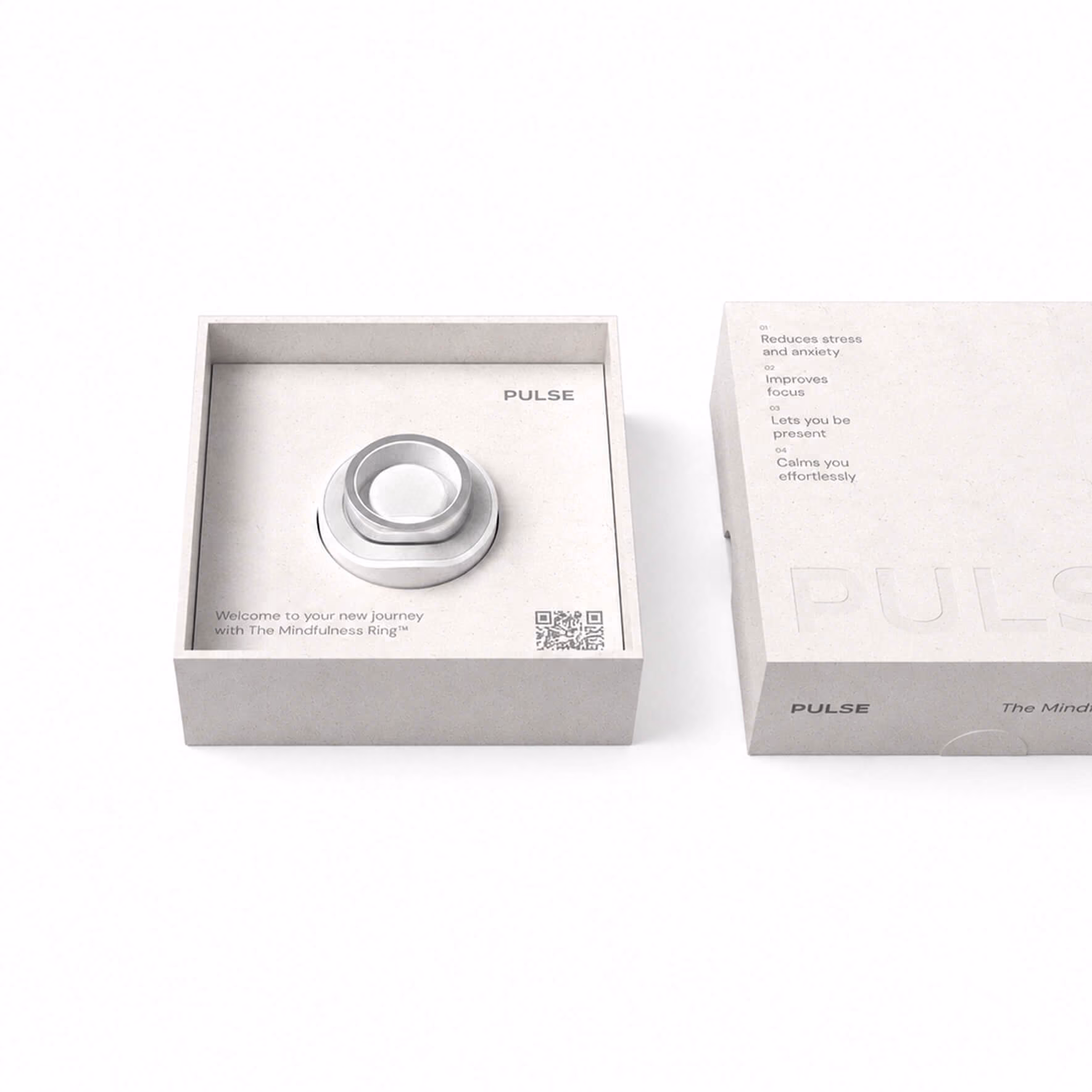 Silver mindfulness rings in a minimalist box labeled Pulse with benefits listed on the lid.