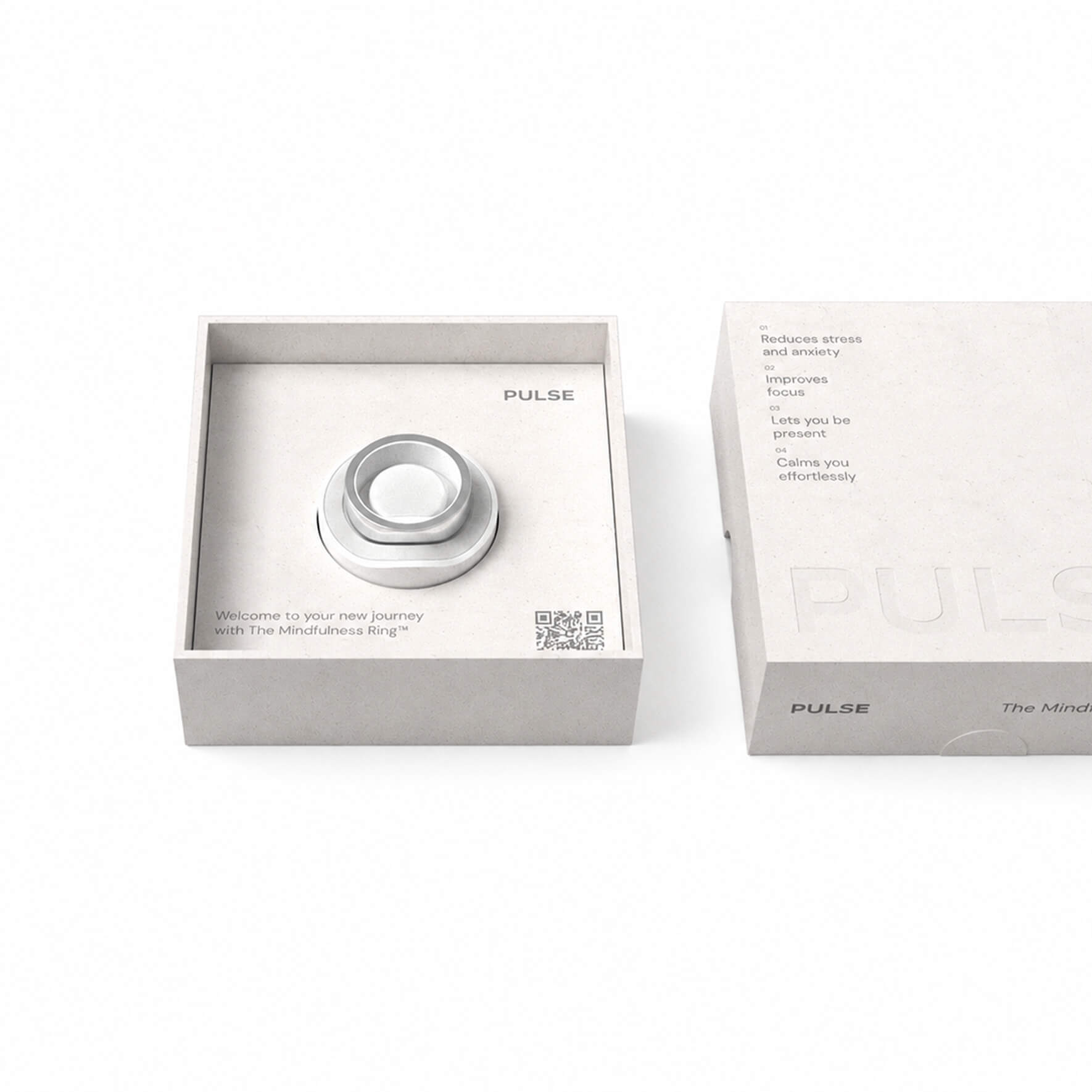 Silver mindfulness rings in a minimalist box labeled Pulse with benefits listed on the lid.