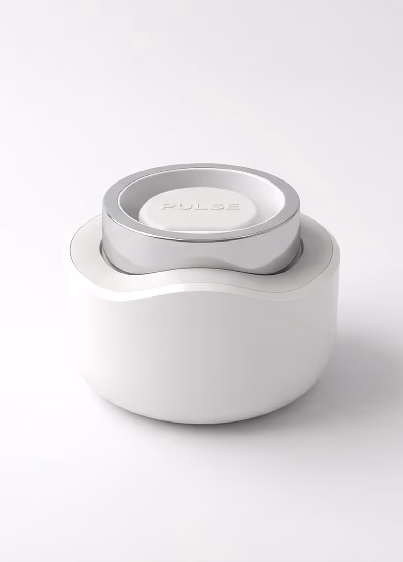 White and silver compact device with a circular button labeled PULSE on top against a white background.