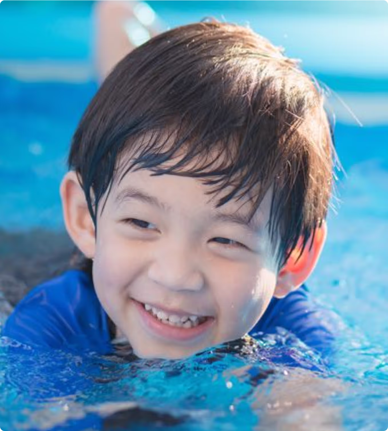 smiling child swimming