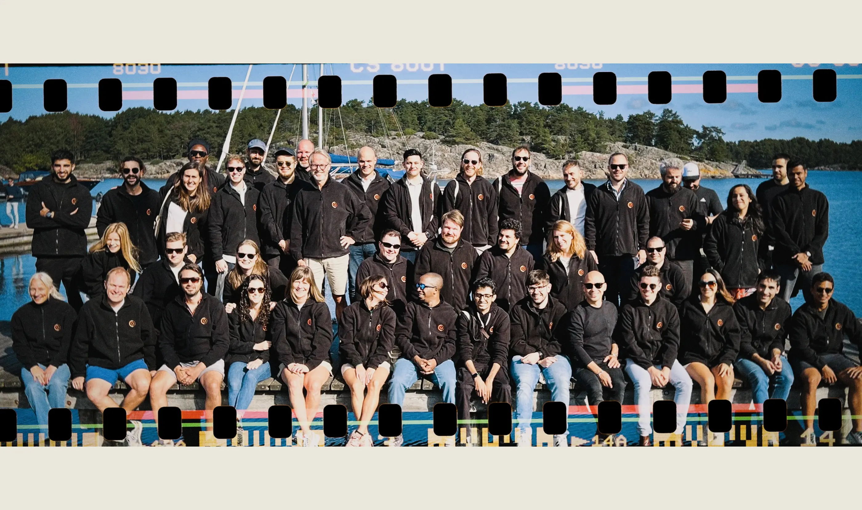 A group photograph of the full company team