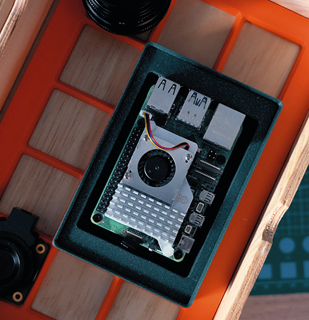 A gridfinity plate with a raspberrypi
