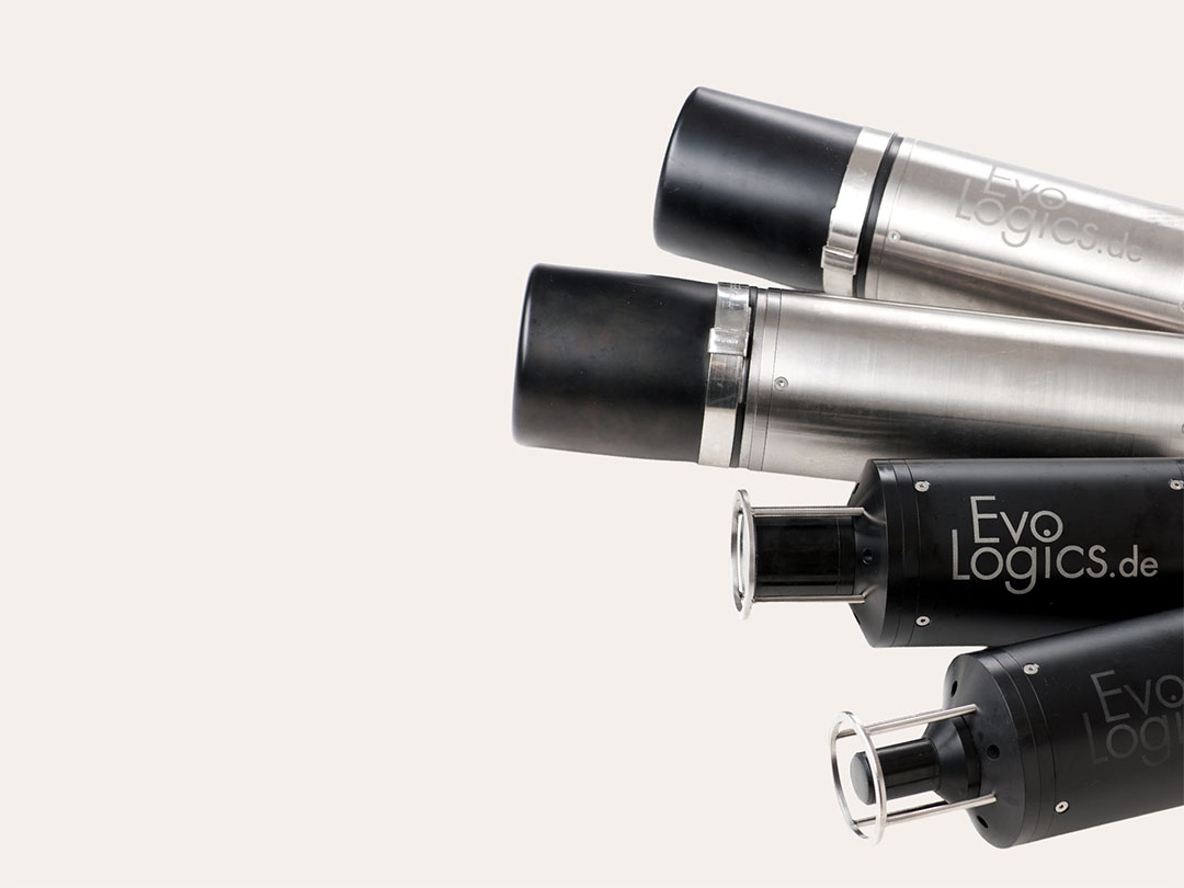 Four cylindrical metal and black acoustic devices labeled EvoLogics.de, shown aligned horizontally on a light background.