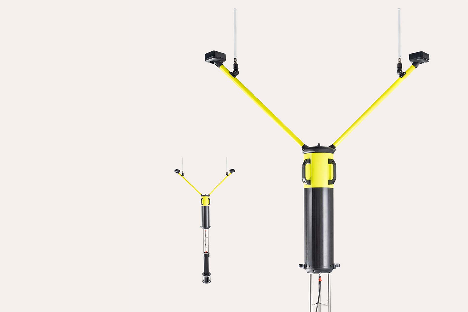 Two black and yellow oceanographic instruments with Y-shaped antennas and cylindrical bodies on a plain white background.