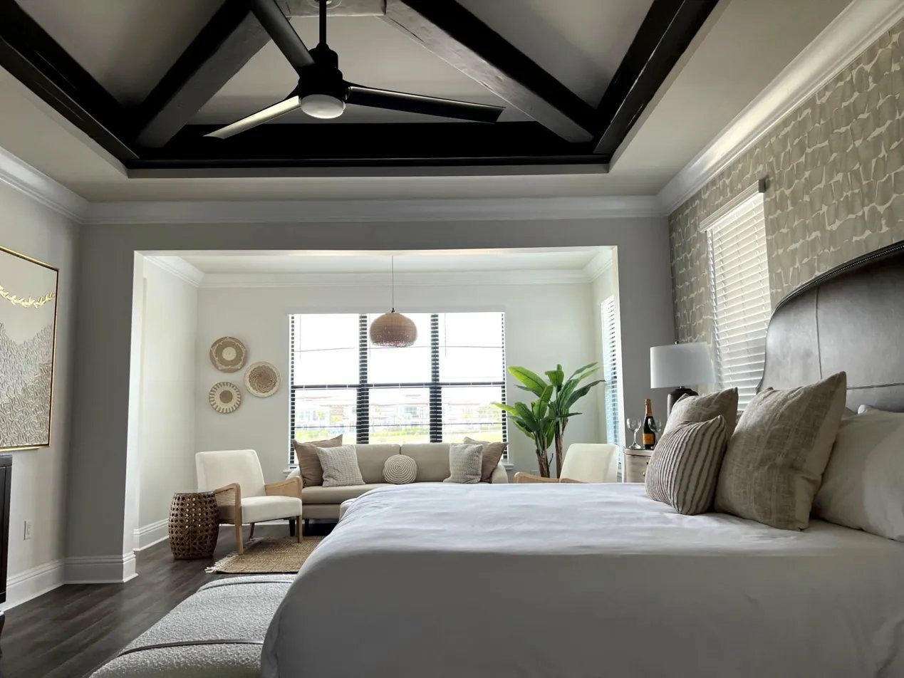 Master suite at The Luxe Palmilla — cathedral ceiling, designer furnishings, every bedroom en-suite