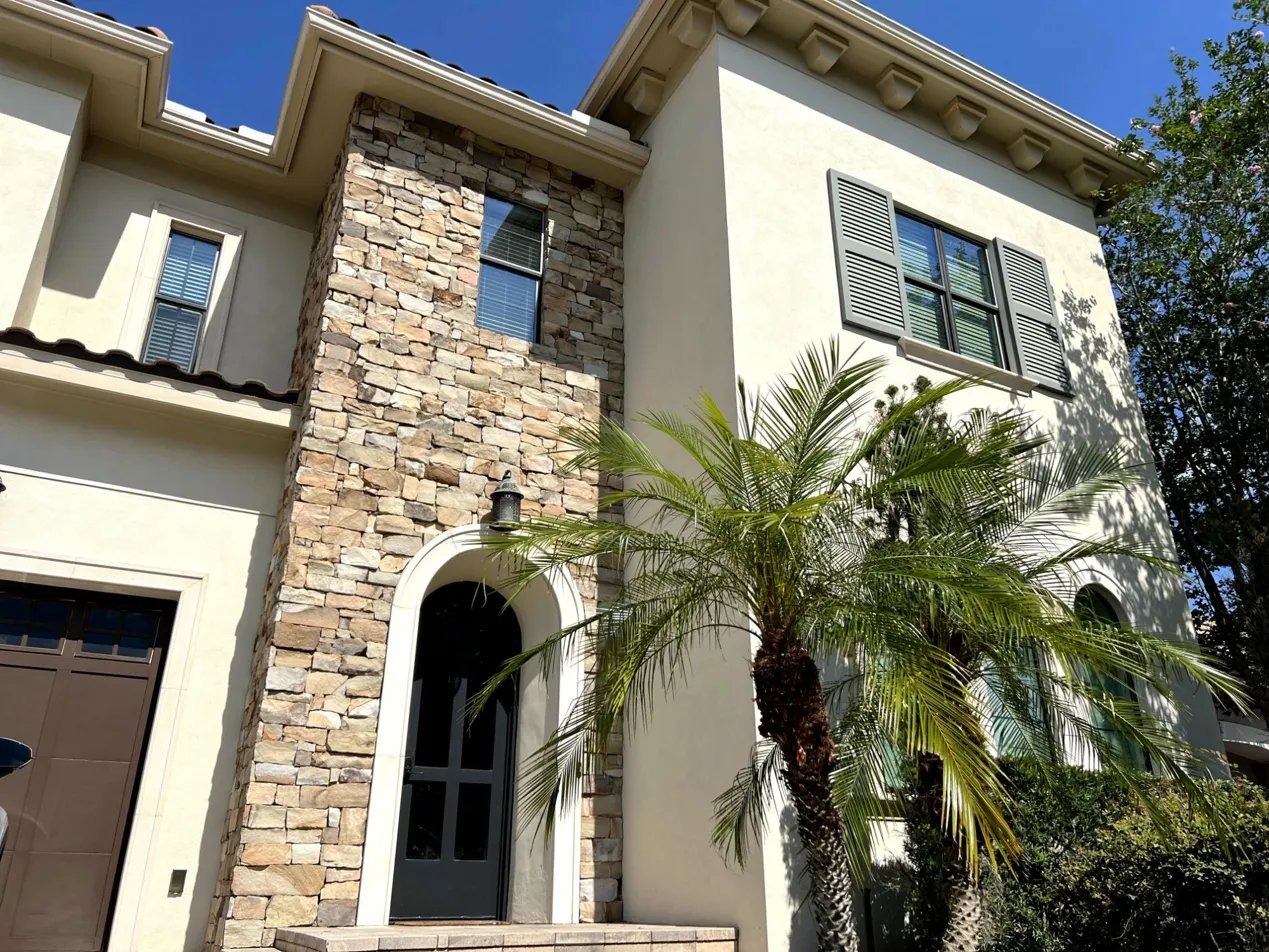 The Luxe Palmilla — stone and stucco entrance at Reunion Resort, Orlando