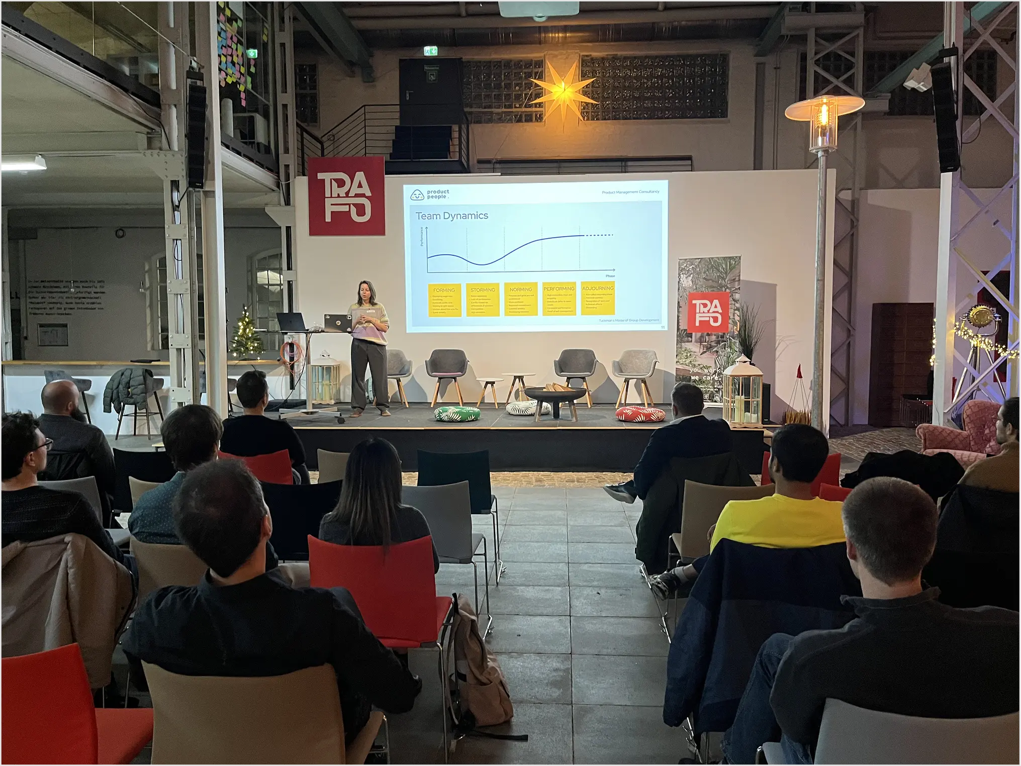 Image of people talking from an offline event by Product People, a product strategy consulting firm.