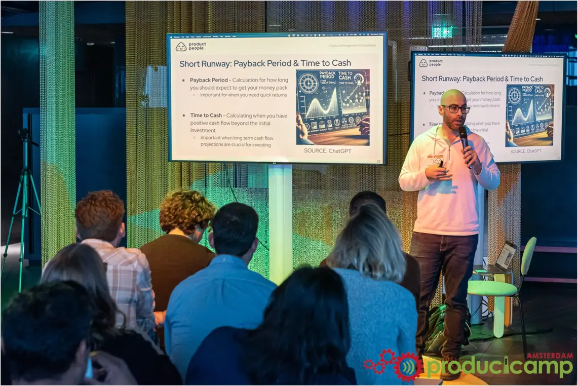Group of product managers engaged in discussion at a product strategy consulting event.