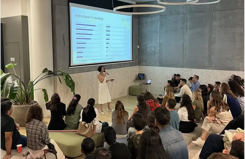 Group of product managers engaged in discussion at a product strategy consulting event.