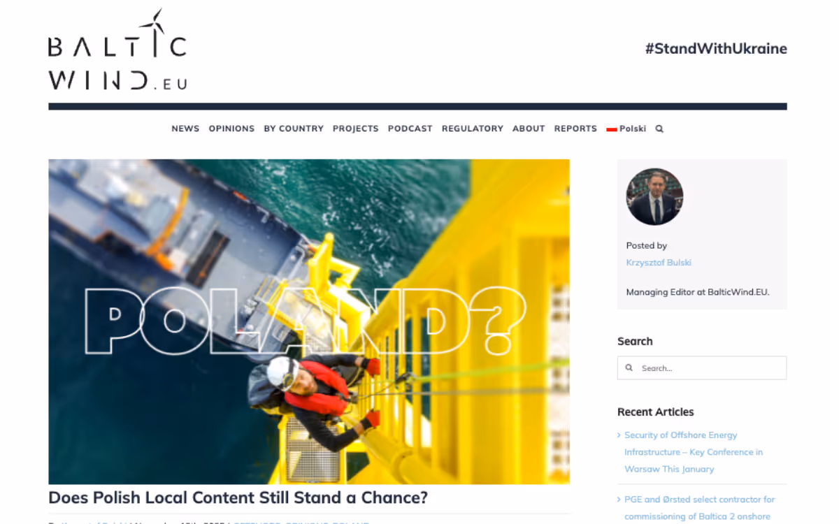 Website screenshot of BalticWind.eu featuring an aerial view of a worker climbing a yellow offshore wind structure over water, with text 'POLAND?' and article title about Polish local content in wind energy.