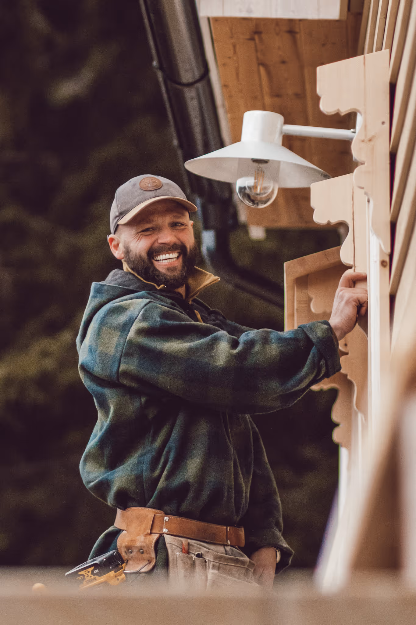 Ben smiling while he is putting up listings on the windows