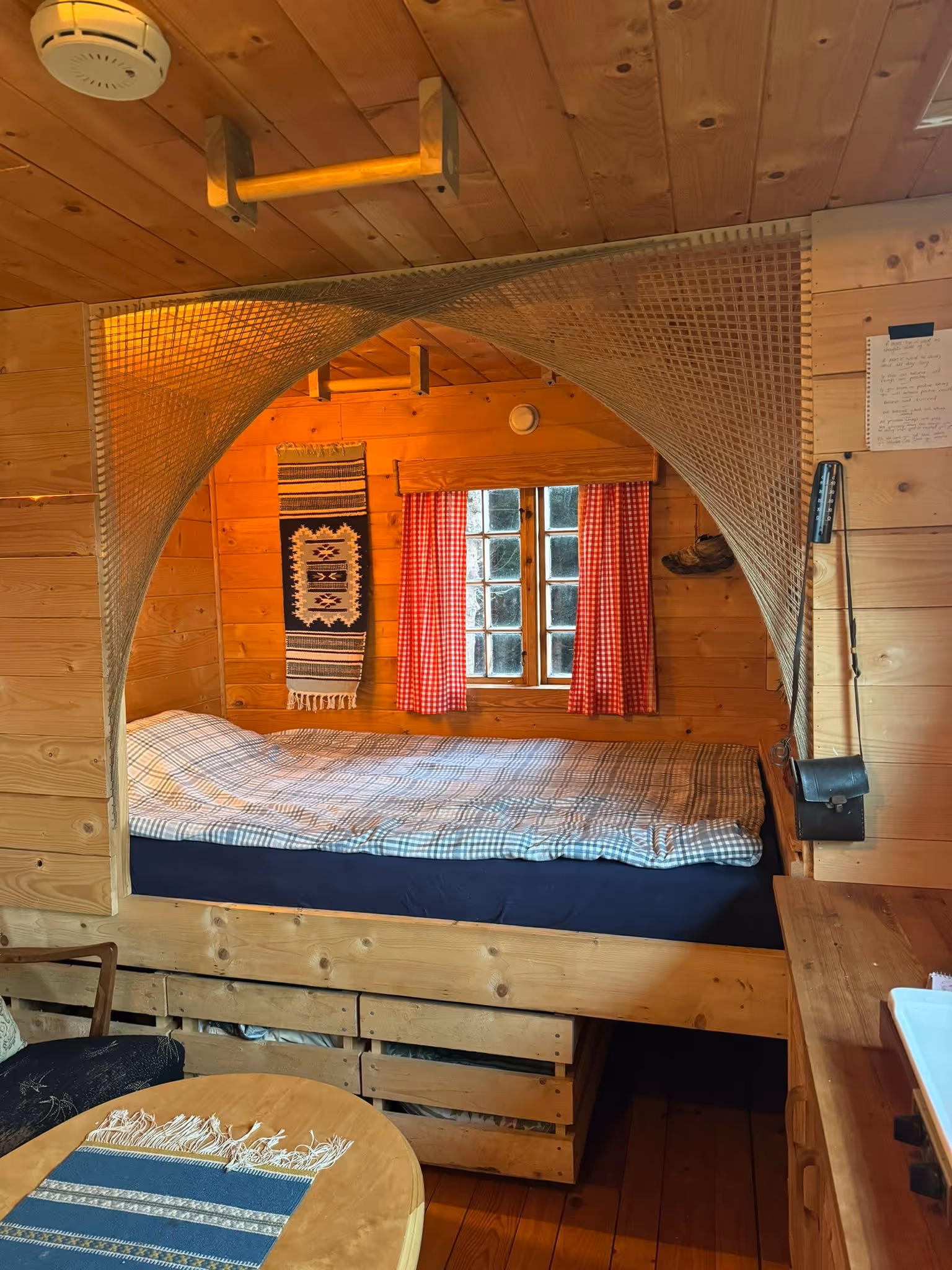 cabin from the inside, couch and bed