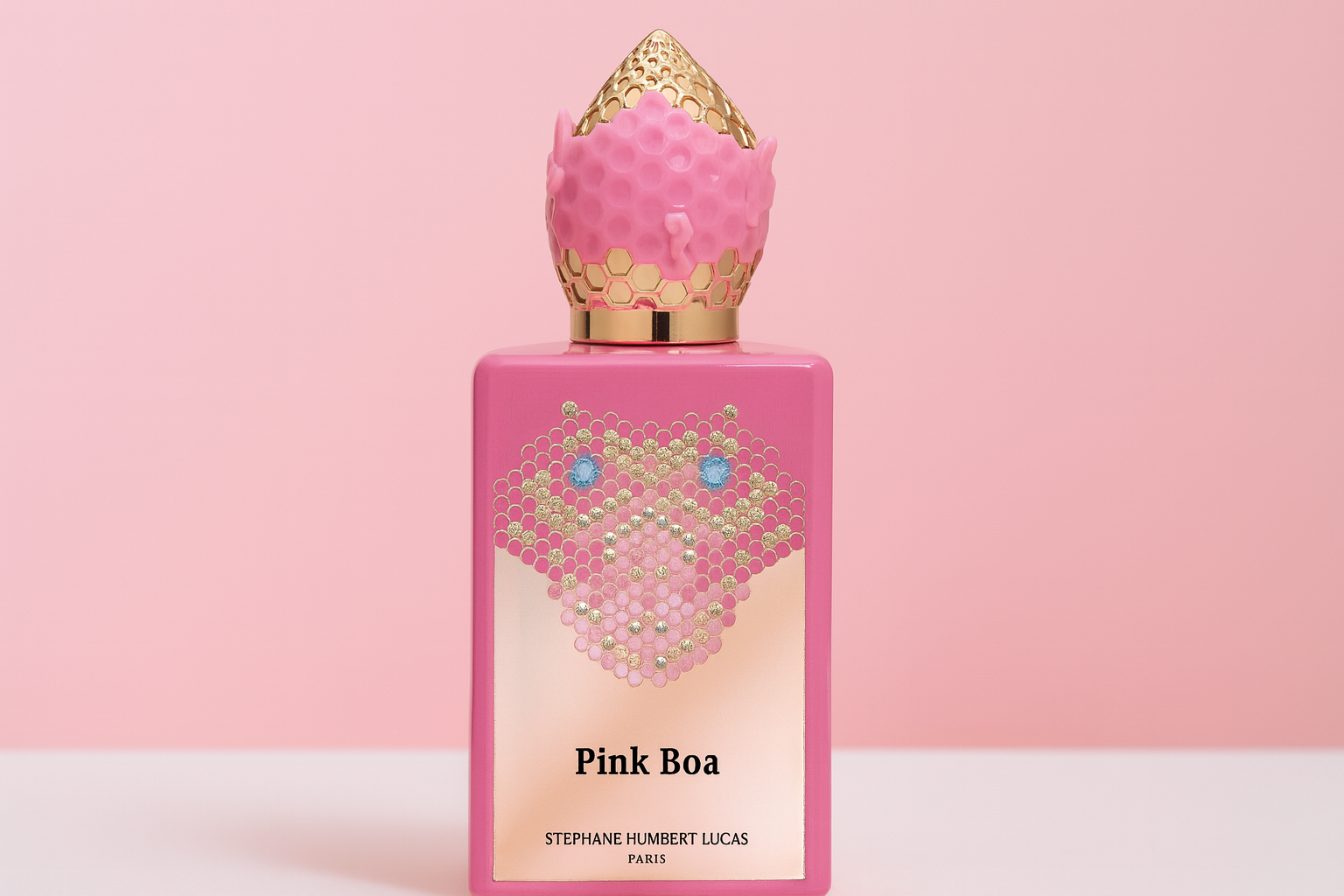 Pink Boa bottle set against a pink background.