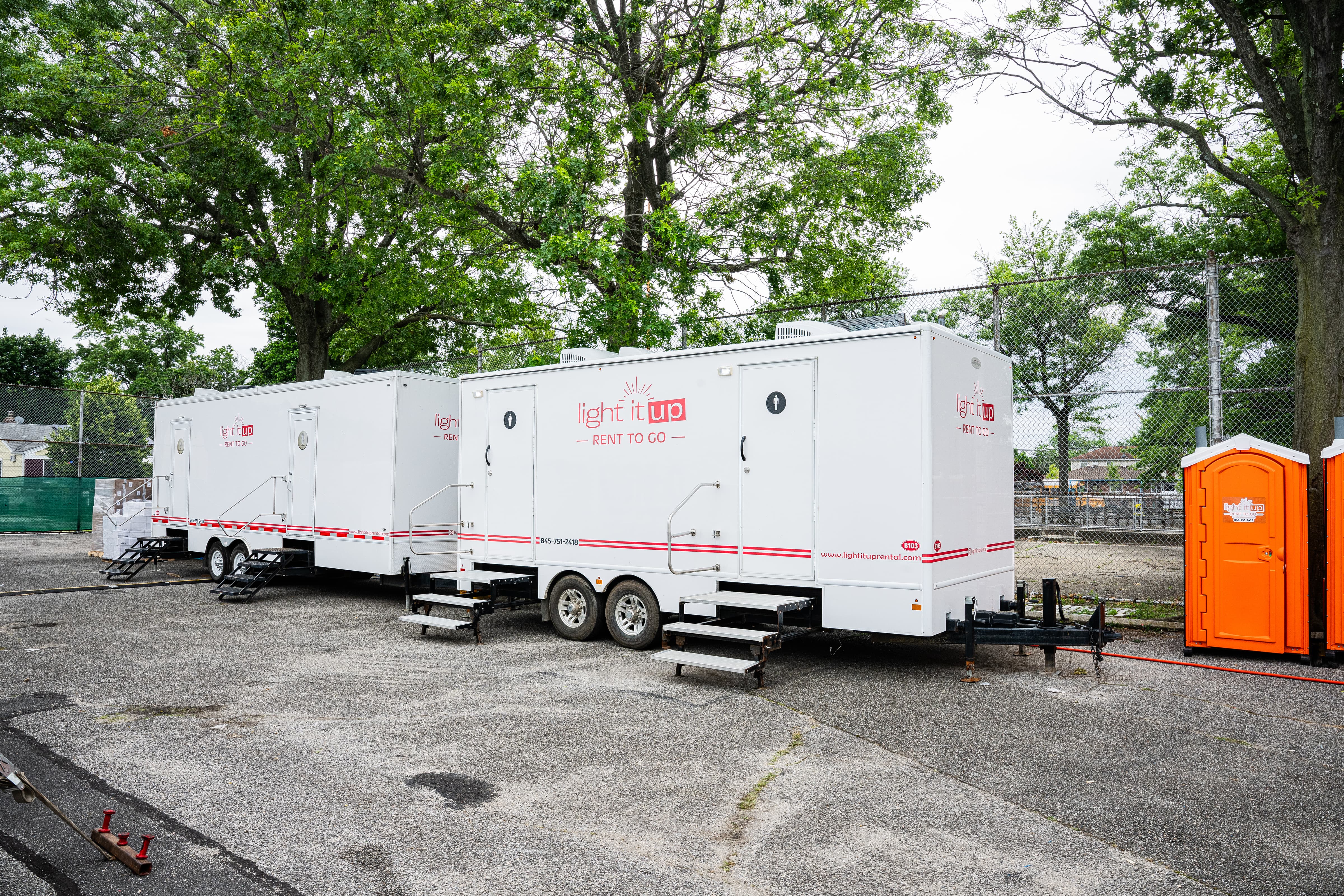 2 restroom trailers in park
