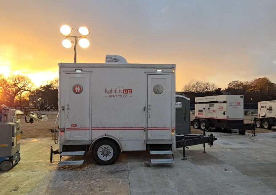 Alt: restroom trailers against winter sunset sky