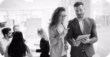 A black and white photo of a man and a woman.