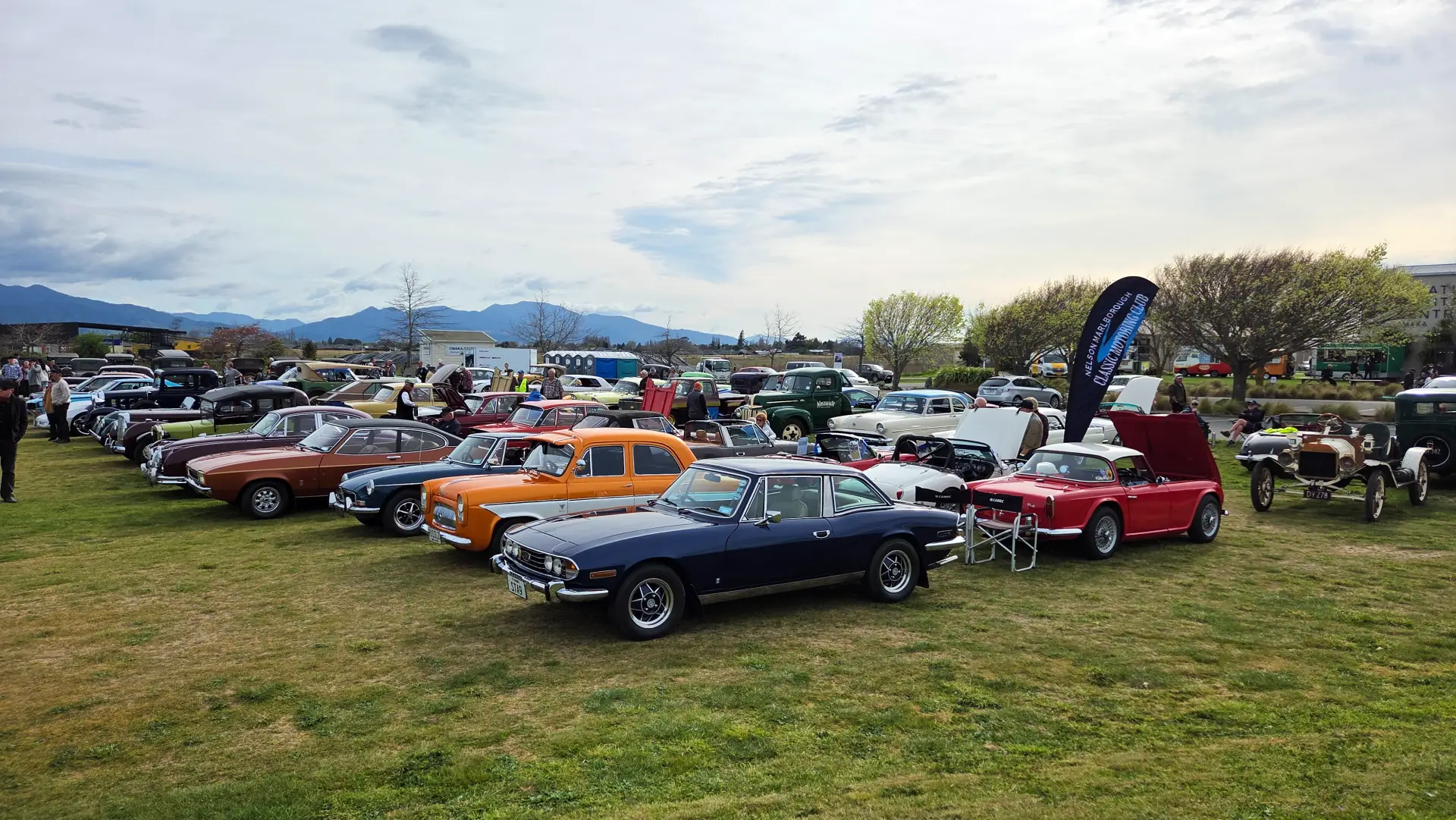 Classic and vintage cars parked on the Omaka Aviation Heritage Centre Grounds during Wings & Wheels Day.