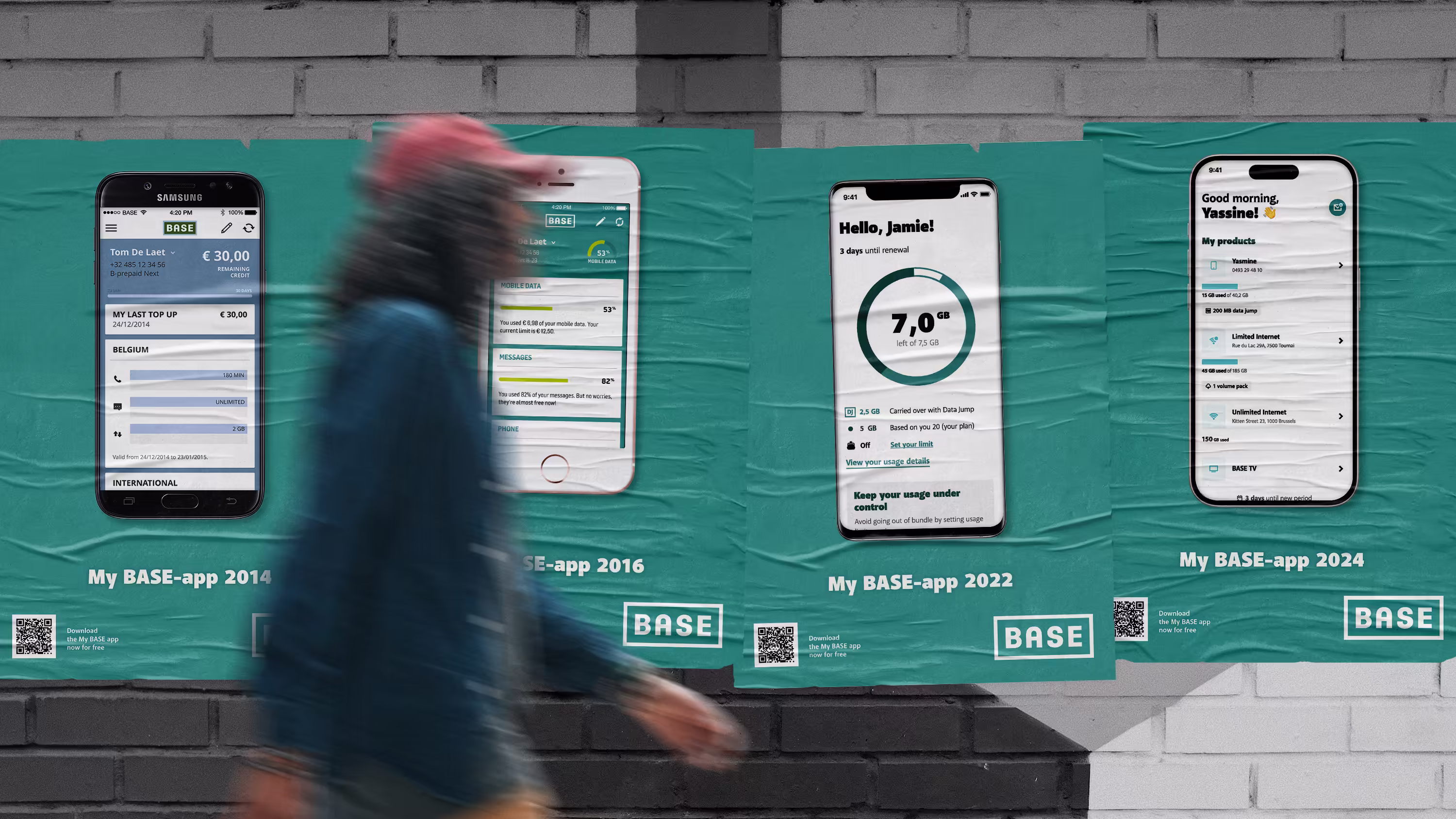 Person walking in front of a poster wall with MyBASE-app advertisement posters.
