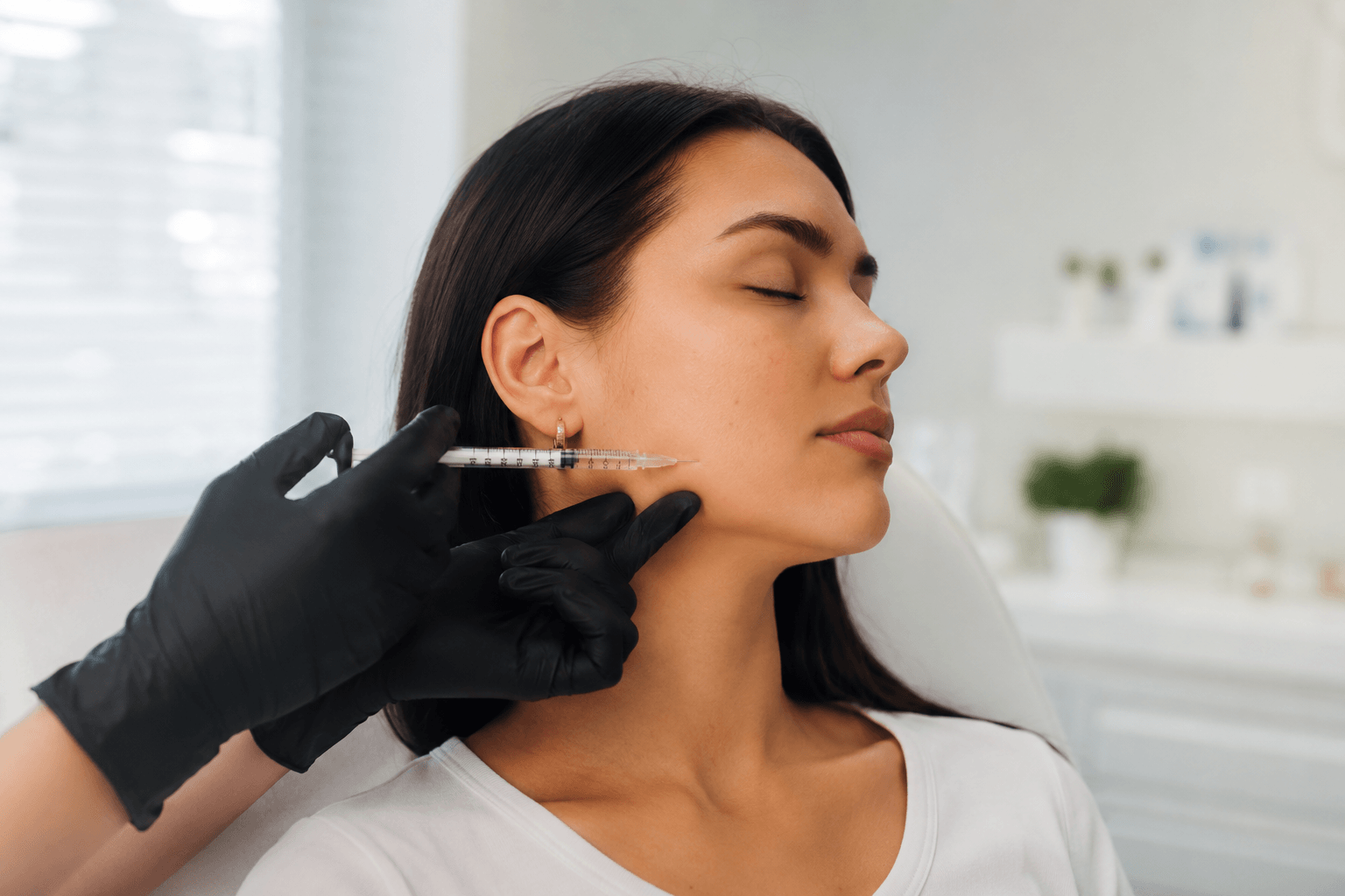 Patient receiving Tox treatment for TMJ pain and jaw tension relief at Elite Medspa in Needham, Massachusetts
