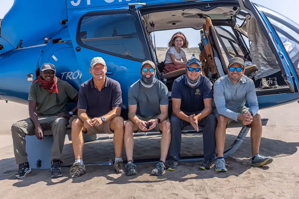 Guides sitting on heli