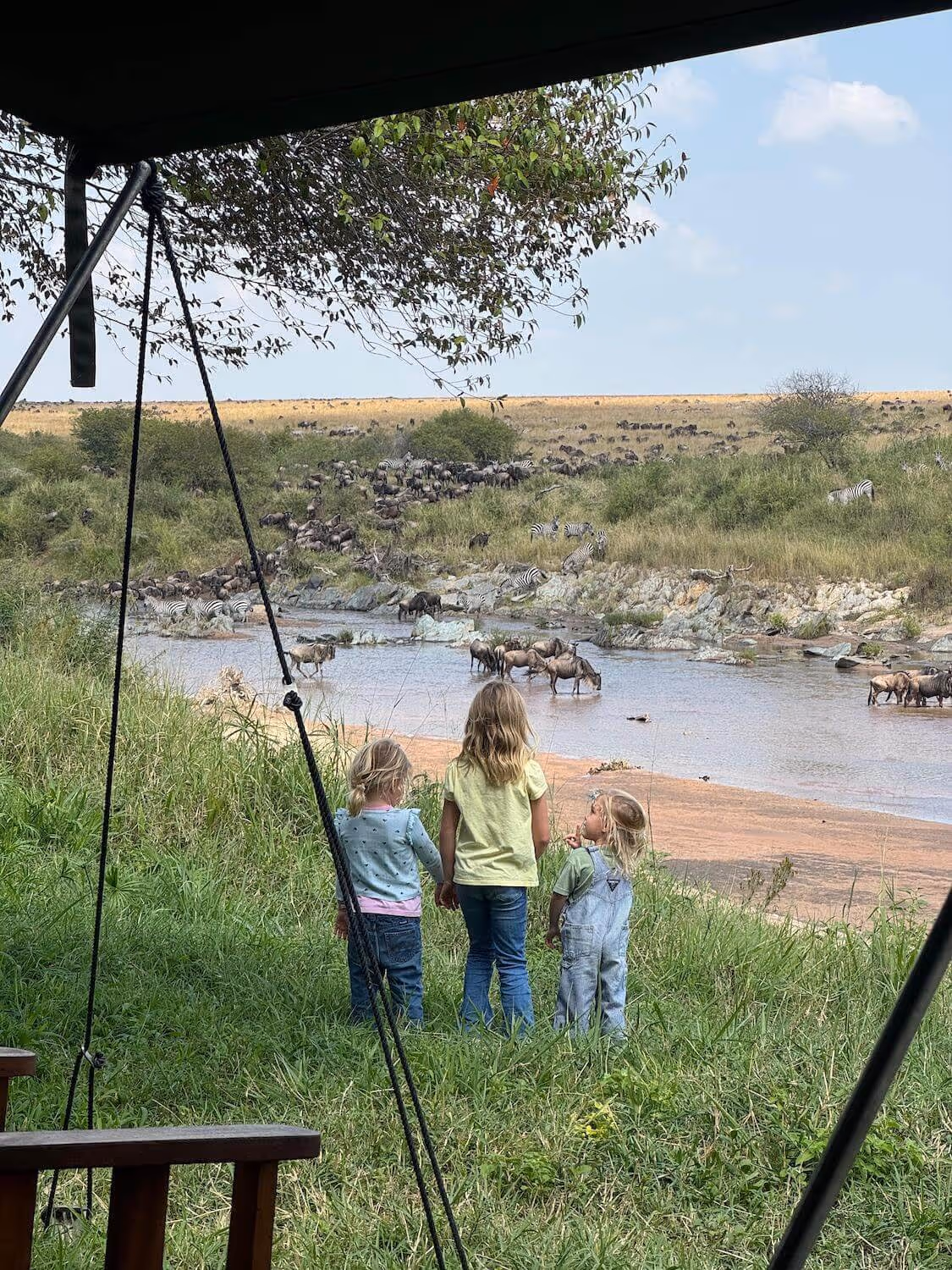 Young girls looking over a river crossing