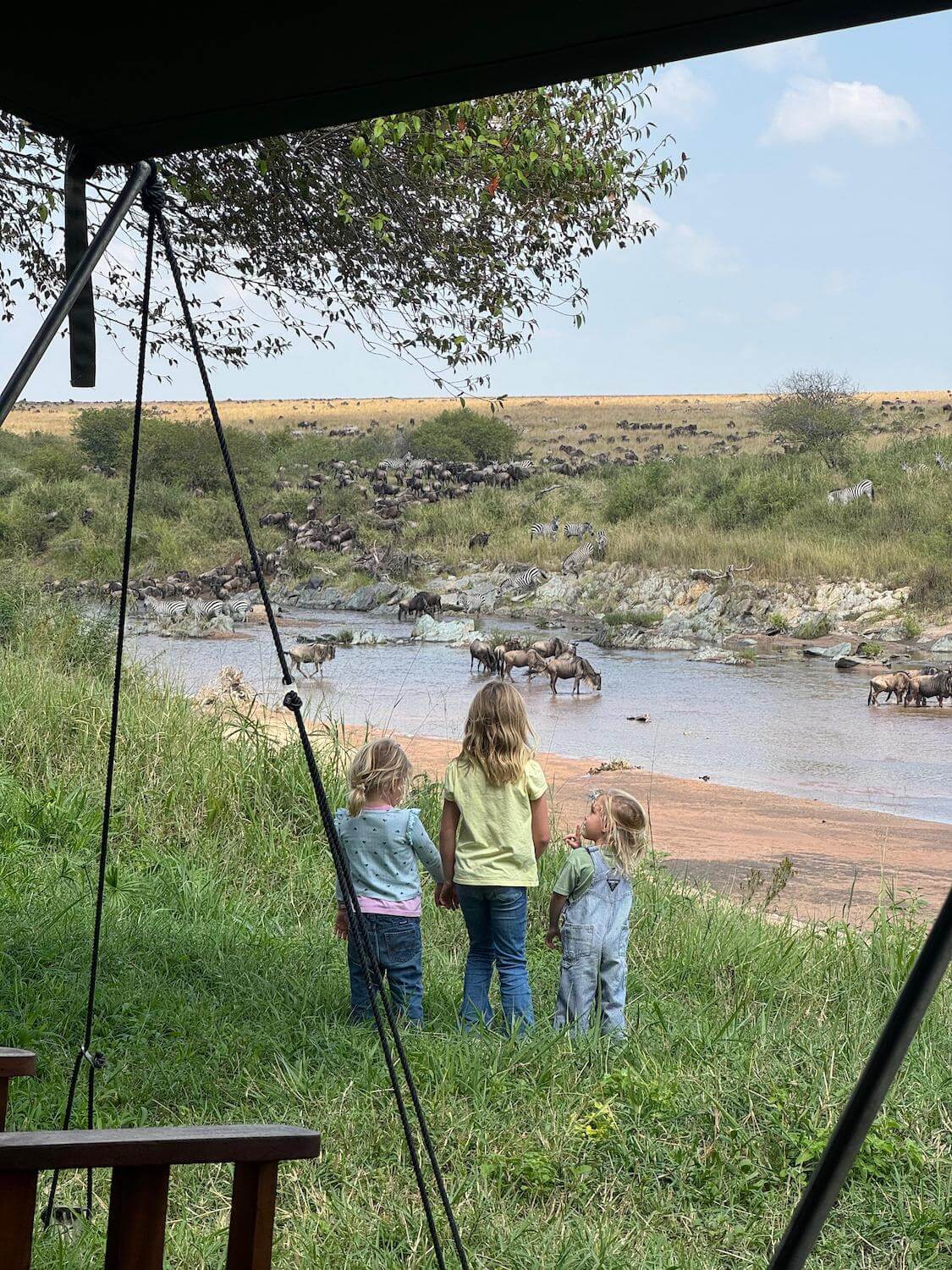 Young girls looking over a river crossing